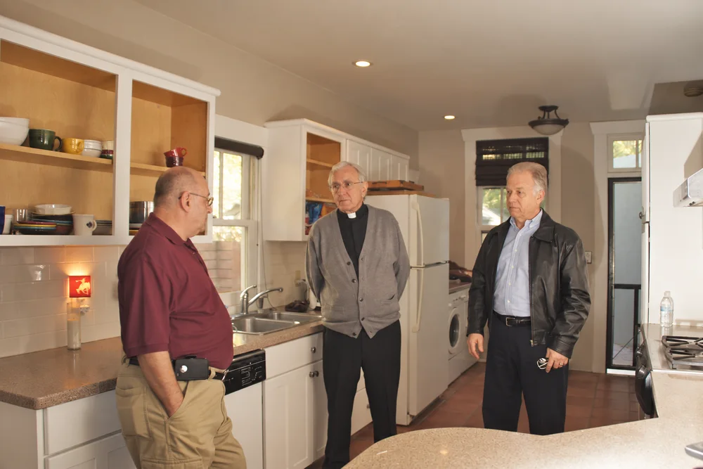 Chaplain Dave Fair, Chaplain Larry Todd, and Chaplain Steve Recadal between filming segments for the Police Chaplain project